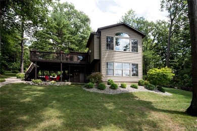 View of lake side front of house with the larger o