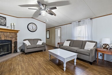 Spacious Family room with wood burning Fireplace.