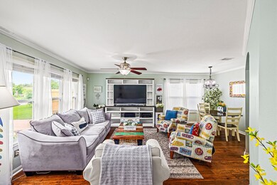 Another view of the living room which is adjacent to the dining area.  Note the interior of the home was painted 2022.