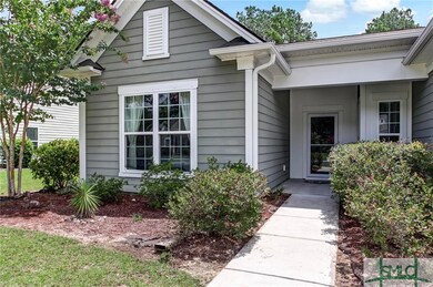 Covered entryway with storm door.