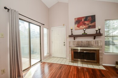 The natural light flows into the entry and family