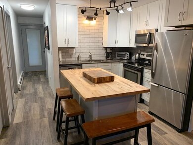 Kitchen featuring stainless steel appliances, ligh