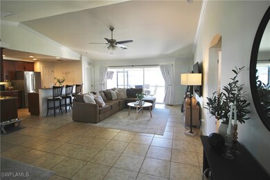 Living room featuring light tile patterned floors,
