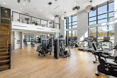 Exercise room featuring visible vents and light wo