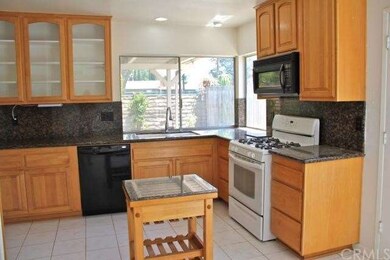 Remodeled kitchen has granite counters and attract