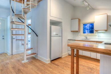 Kitchen and Staircase to Loft/Storage