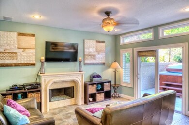 A beautiful limestone fireplace centers the living
