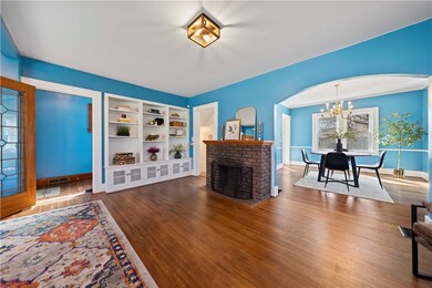 Living area with arch way into formal dining room