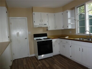Kitchen with new flooring and new dishwasher