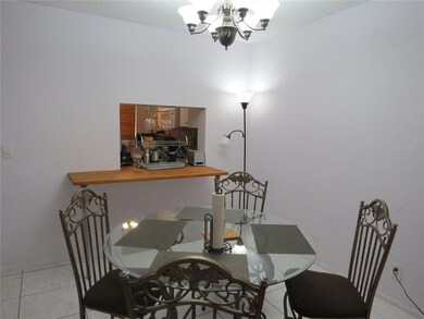 Dining room with pass-through to the kitchen.