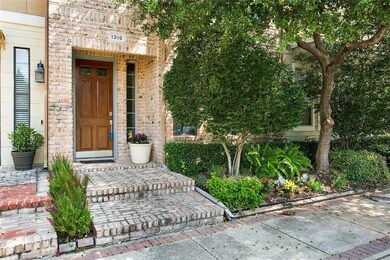 YOUR 3 STORY TOWN-HOME IS BEAUTIFULLY LANDSCAPED W