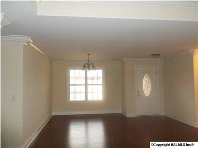 RICH HARDWOOD (LAMINATED) FLOORING IN ALL ROOMS, TREY CEILING IN GREATROOM & CUSTOM CROWN MOLDING