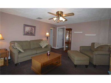 Living Room. Cozy rug surface atop original hardwo