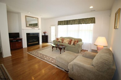 Great room with gas fireplace and hardwood flrs
