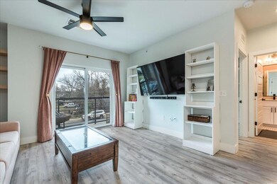 Living area featuring wood finished floors and ce