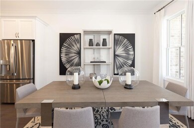Tons of space for a large dining table. Photos are