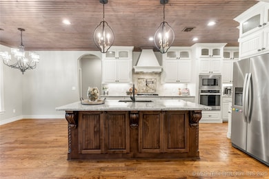 Appliance cabinet with outlets next to fridge.