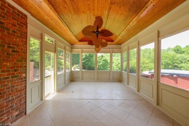 Check out the ceiling in this relaxing screened porch