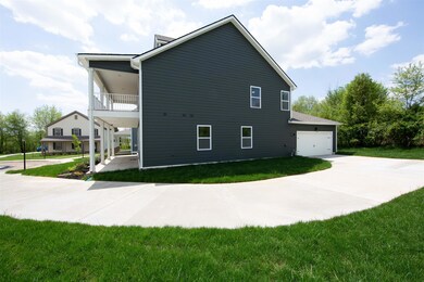 Side entry garage with extended driveway
