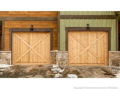 Exterior Front. Garage doors featuring architectur
