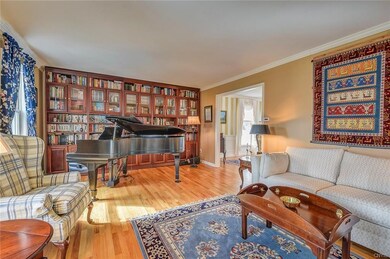 Large living room used as music room.  The bookcas