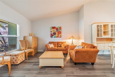 Livingroom, open to dining room with access to poo