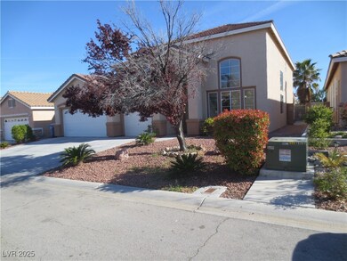 View of front of house featuring stucco siding, a