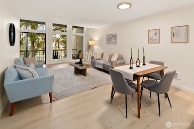 Dining area and living room enjoy a view of the lake.