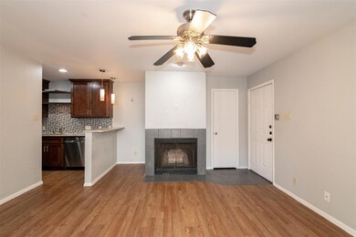 Unfurnished living room featuring a ceiling fan, 