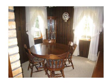 Dining Room. The dining room features carpeting, a