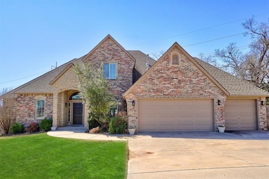 View of front of house featuring concrete driveway, an attached garage, brick siding, and a front yard