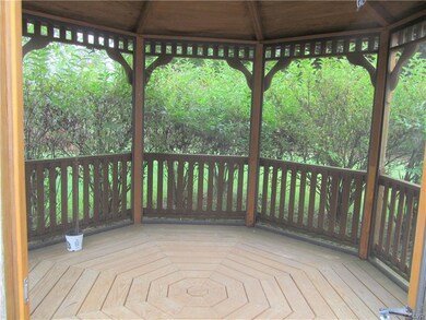 Screened in gazebo. Bushes provide lots of privacy