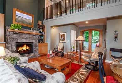 Stone Fireplace flanked by built-in Bookcases in G