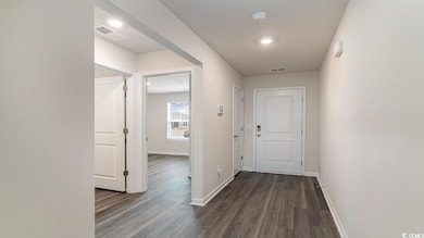 Hall featuring dark hardwood / wood-style floors