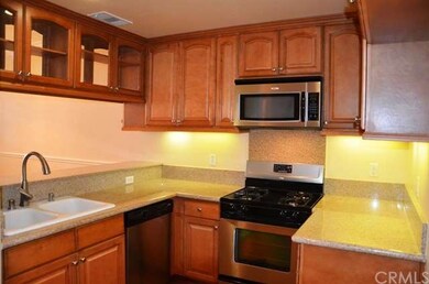 Upgraded kitchen with granite counters, stainless 
