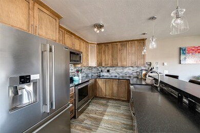 Kitchen featuring appliances with stainless steel