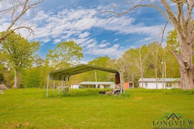 View of yard with a carport