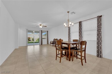 Dining space with visible vents, light tile patter