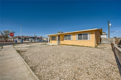 View of front of house featuring fence and stucco