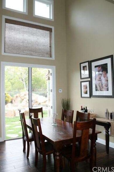 Formal dining space with French doors leading out 