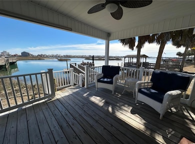 Dock area featuring a deck with water view