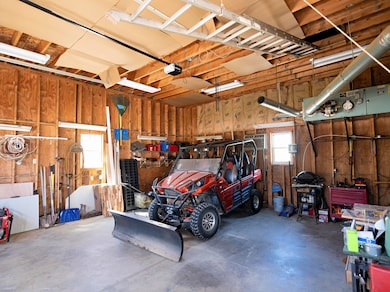View Inside Garage w/ Storage Above
