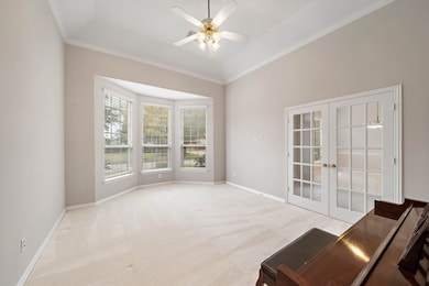 The formal living room includes french doors which would make an ideal study, and includes a bay window and ceiling fan.