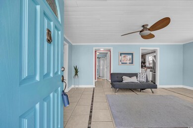 Entryway featuring light tile patterned floors, cr