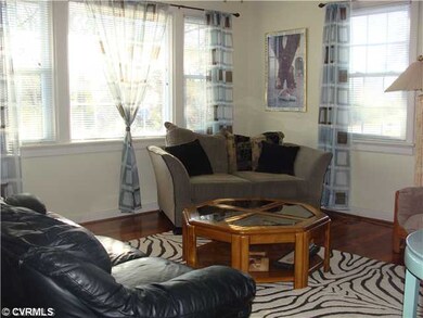 Living Room - The Picture Window fills this room with light.  Hardwood floors throughout. Coat closet. LIghted ceiling fan. There are many options for furniture placement in this room.