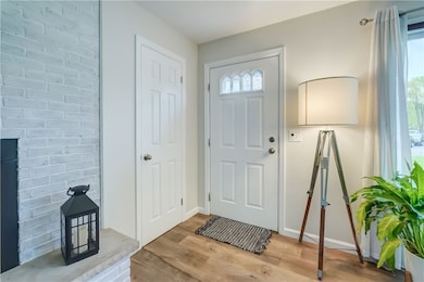 Enter the front door into the living room.