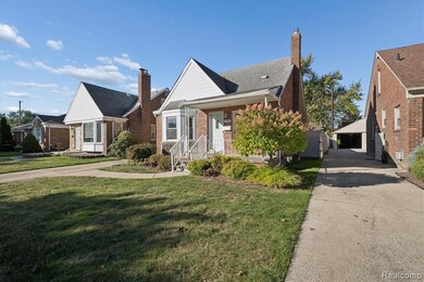 Bungalow featuring a front yard, an outbuilding, brick siding, a chimney, and a porch