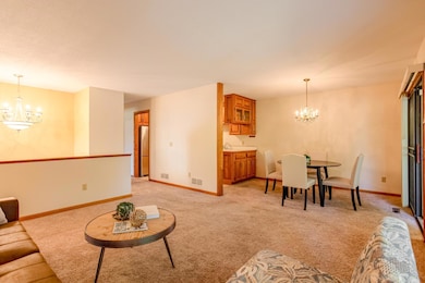 Spacious and open floor plan offering convenient access to the living, dining, and kitchen areas.