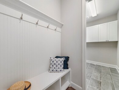 Mud room is just off the garage, perfect for storing backpacks, jackets, shoes etc.