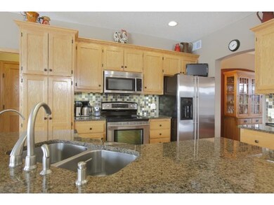 The kitchen has tons of lighting including drop do